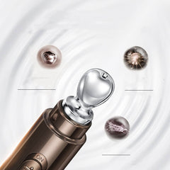Eye cream for puffiness and dark circles applicator with metallic tip and serum beads on a swirling background.