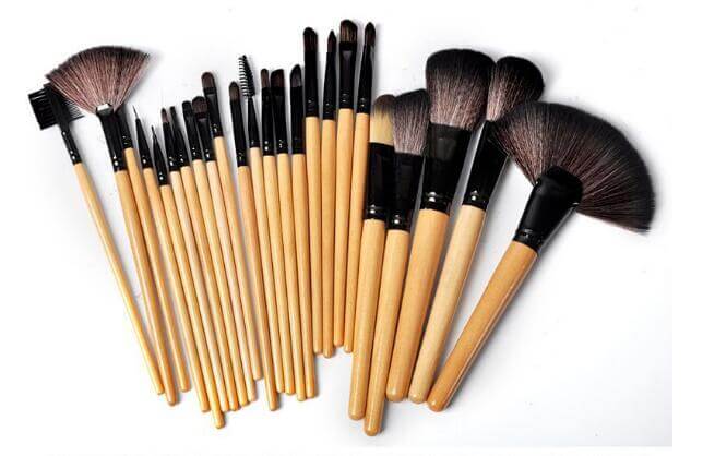 24-Piece Makeup Brush Set displayed with high-quality wooden handles and various brush shapes for professional makeup application.