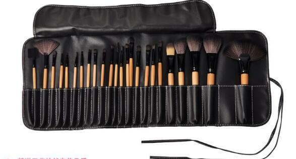24-Piece Makeup Brush Set displayed in a compact roll-up case, featuring professional brushes for makeup application.