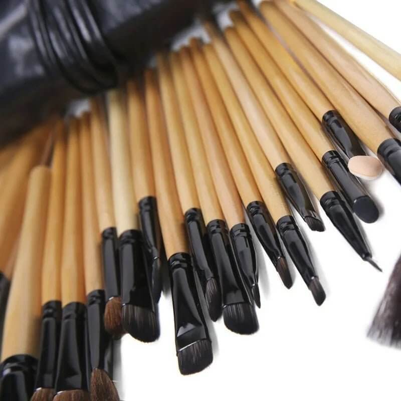 24-Piece Makeup Brush Set featuring professional brushes with bamboo handles and a stylish gift bag.