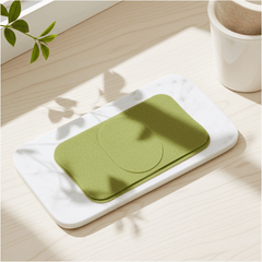 Detox foot patch placed on a marble tray surrounded by greenery, promoting foot refreshment and revitalization.