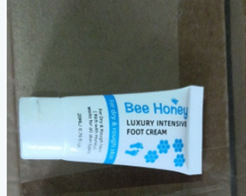 Honey foot repair cream tube designed for deep hydration of dry cracked skin.