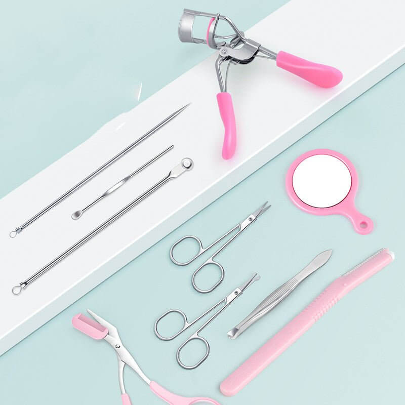 Makeup tools and accessories set including eyelash curler, scissors, tweezers, and mirror on a pastel background.