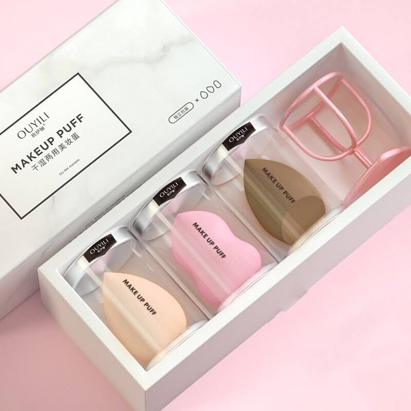 Makeup Sponge Beauty Blender Set containing various sponges in a box with a puff cleaner, ideal for a flawless finish.