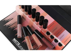 12-color lip gloss set displayed with various shades in packaging on a stylish black background.